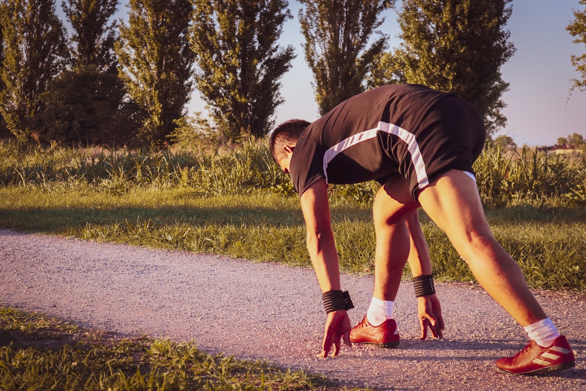 How to prevent cramps while running guide for South African runners stretching at the roadside