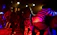 A vibrant photo of the gospel group passionately singing on stage during a live concert.
