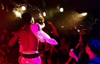 Greg “G Money” gripping the mic, mid-song, with sweat glistening under stage lights.