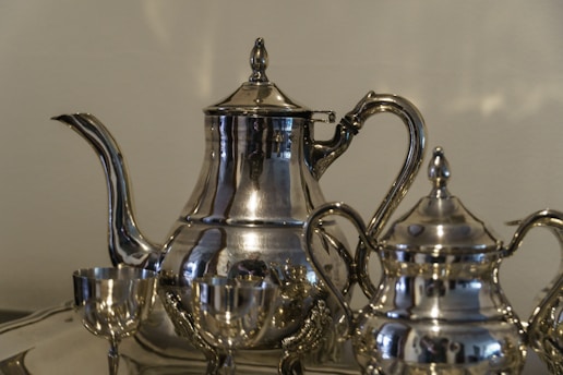 a tea kettle and glass