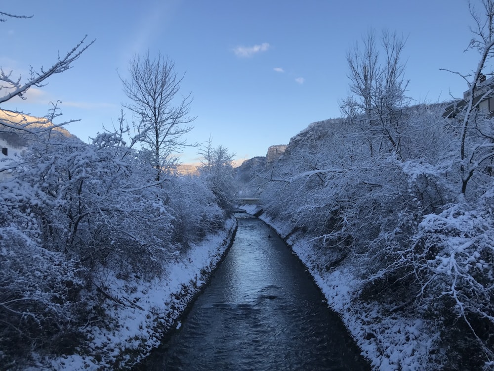 a river with snow on the banks