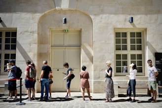a group of people standing outside a building
