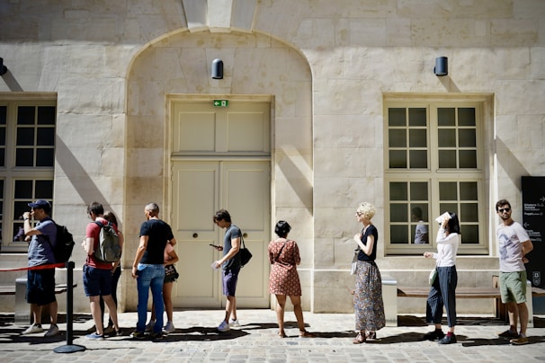 a group of people standing outside a building