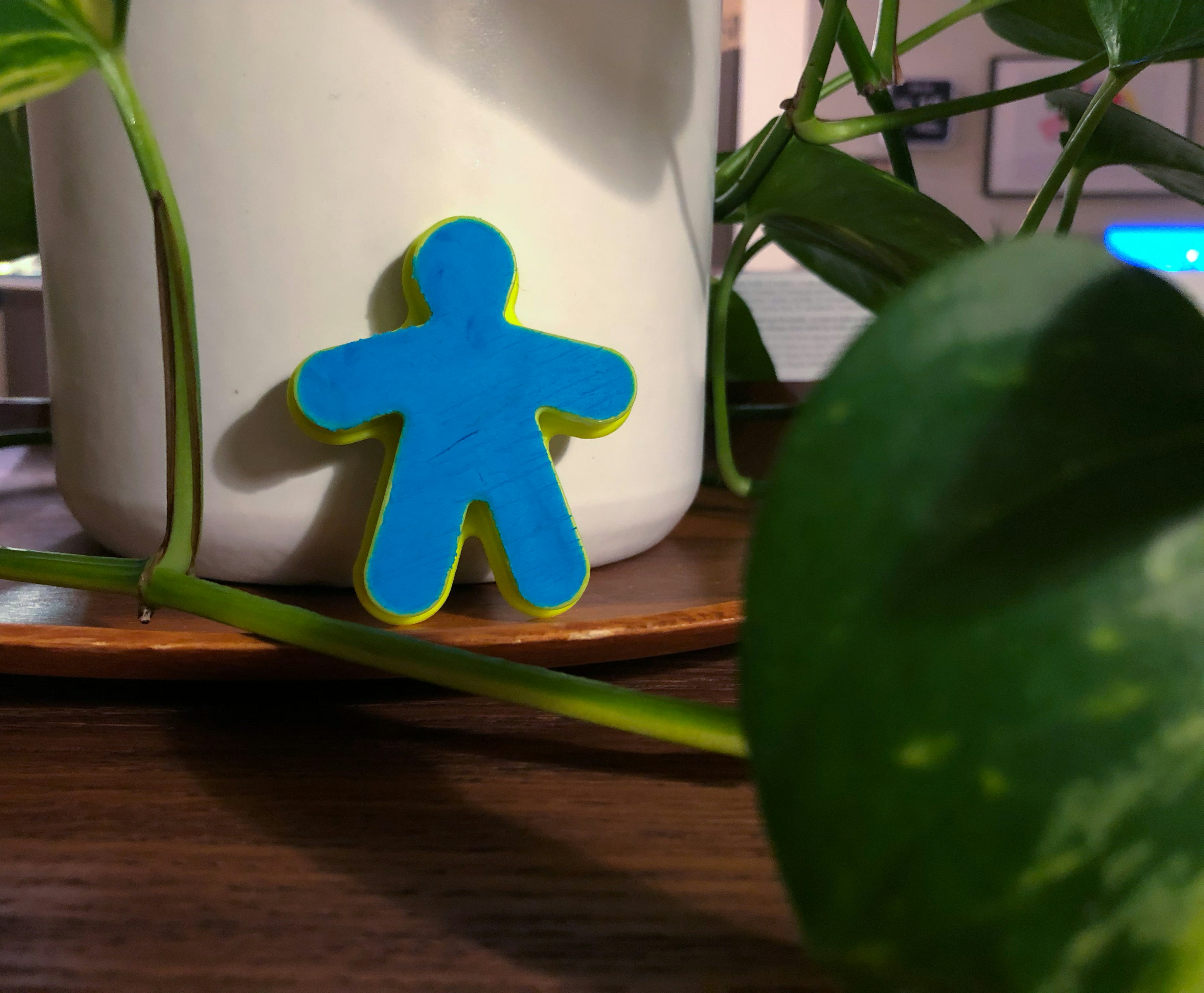 Play-doh and cookie cutters on a wooden table.