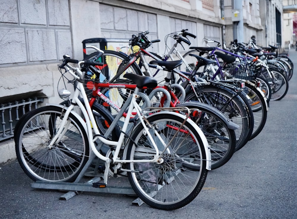 a group of bicycles parked on a rack