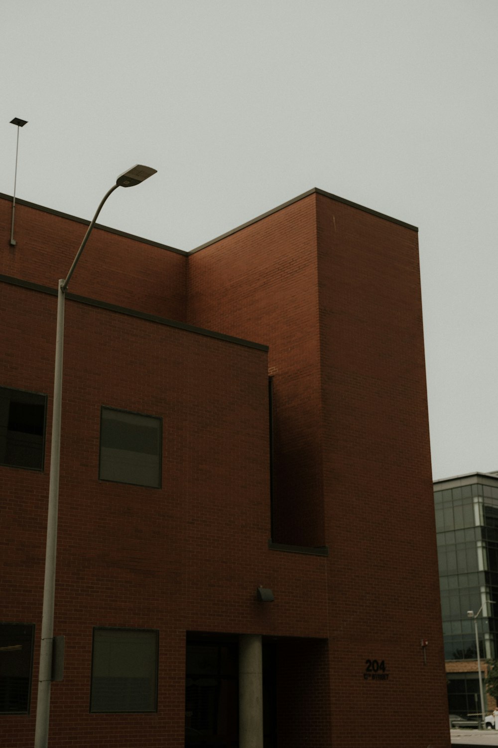 a brick building with a light pole