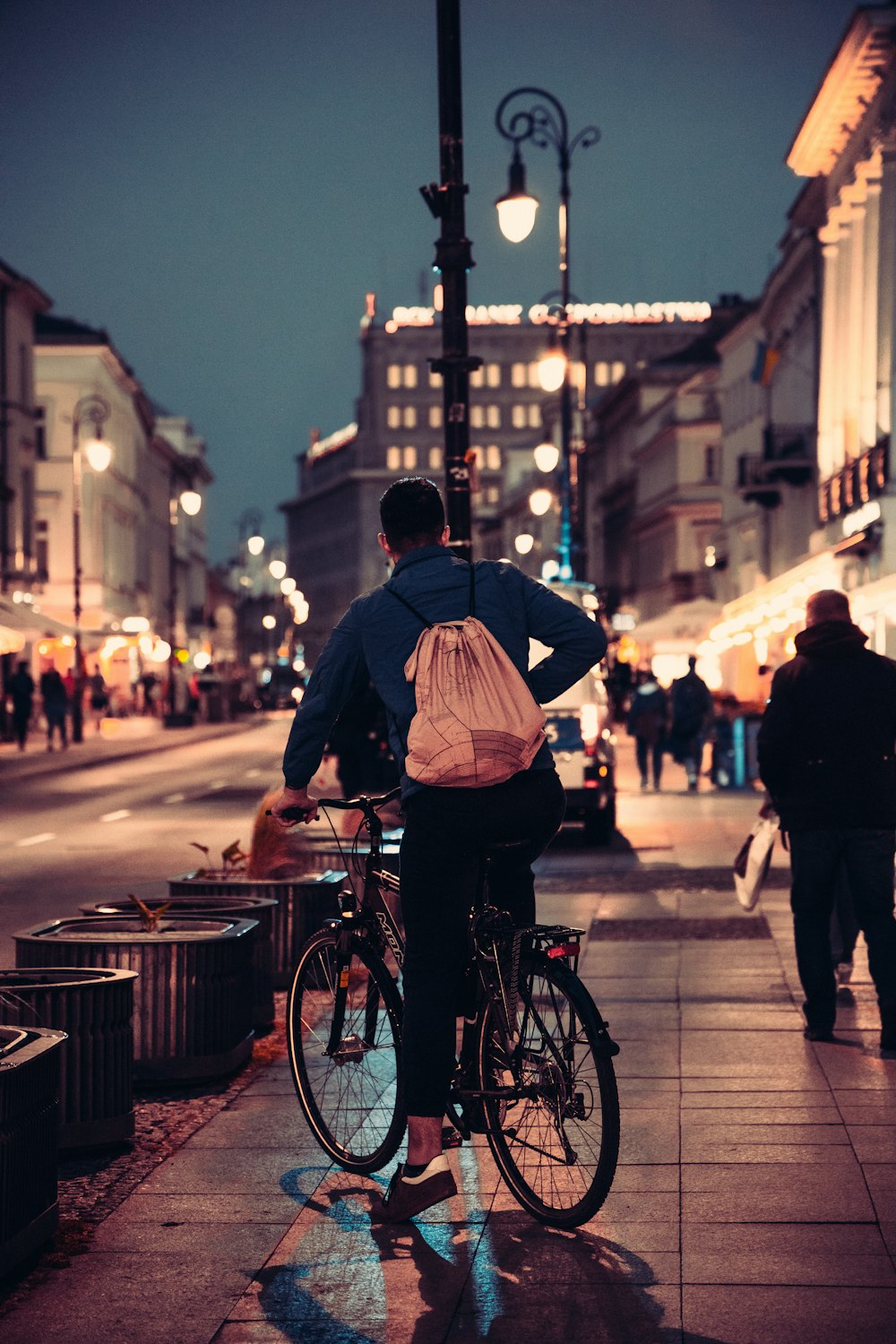 a person riding a bicycle on a city street