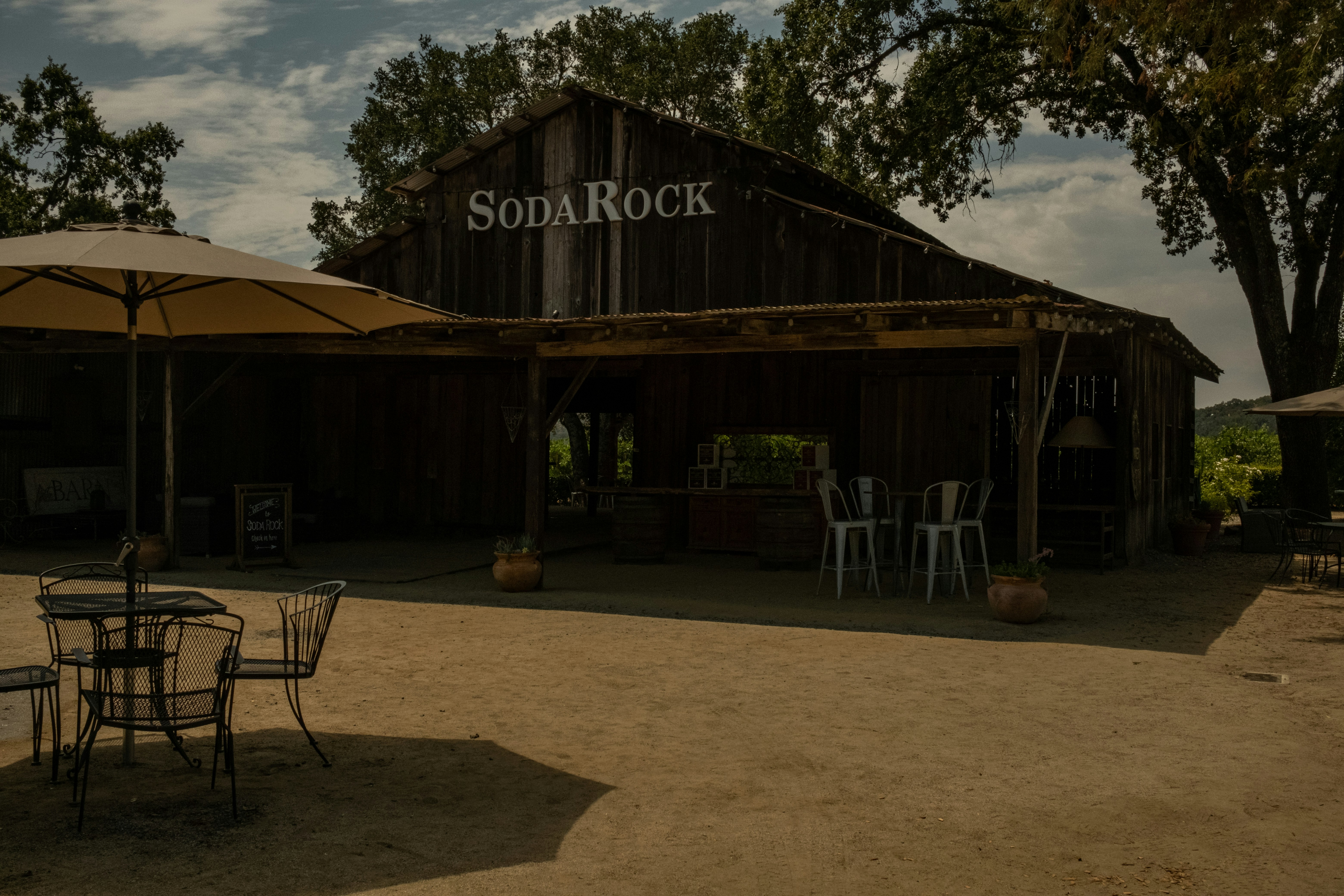 Stop image for Taos Adventure Loop: 3 Days of Family & Nature Escapes - a restaurant with tables and chairs -  in Southwest USA - Photo by Megan O'Hanlon on Unsplash