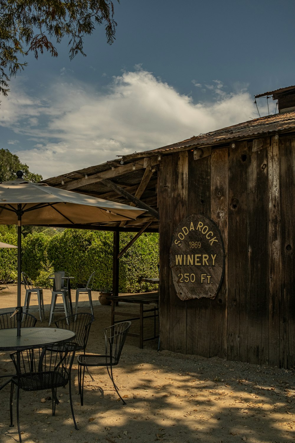 a wood building with a sign on it