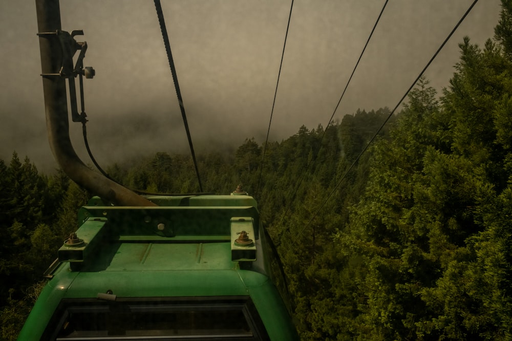 a green cable car