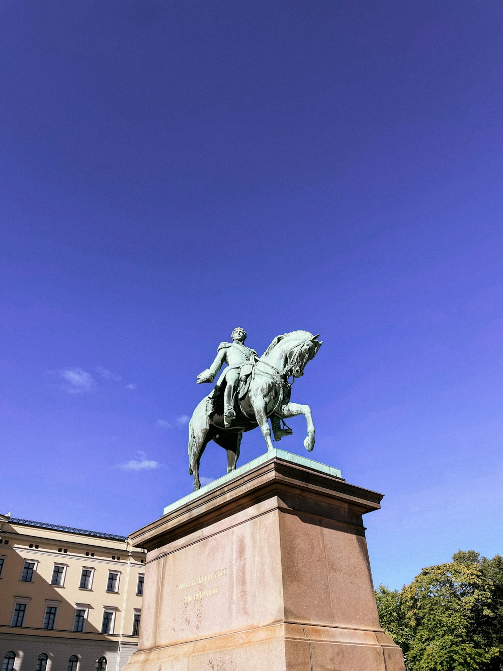 a statue of a person riding a horse