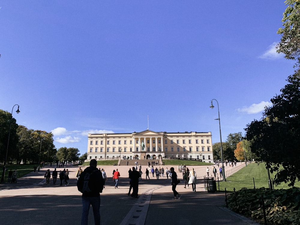 a large building with many people walking around