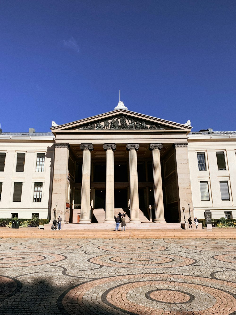 a building with pillars and a courtyard