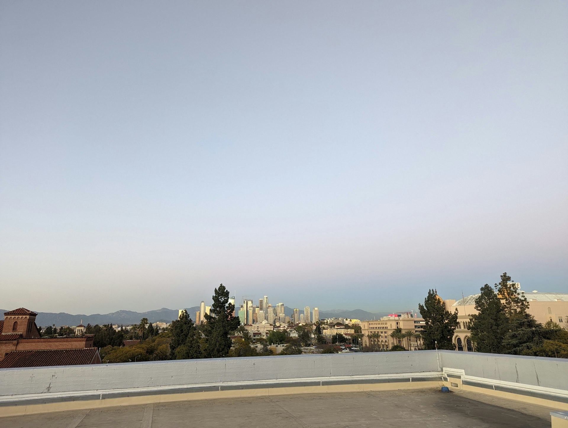 a city landscape with a body of water and trees