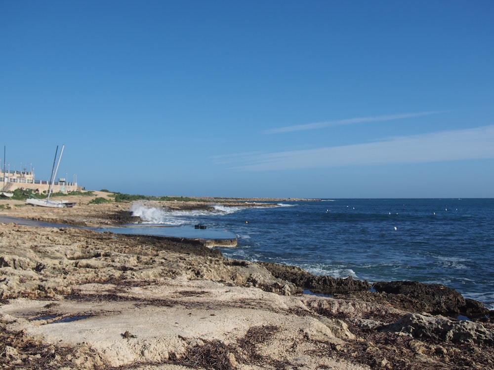 a beach with rocks and water