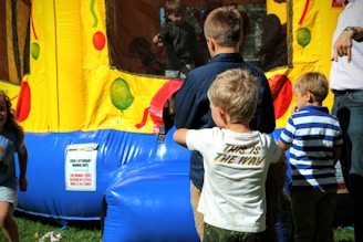 a group of people looking at a painting