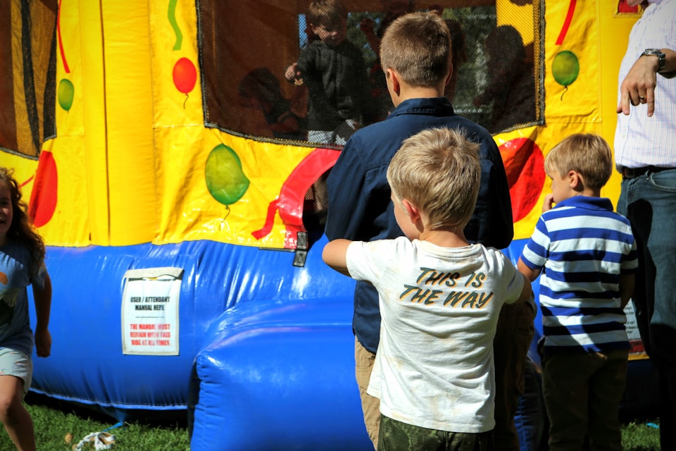Stock photo of a colorful inflatable bounce house featured in a blog about bounce house rental website design by Cannone Marketing