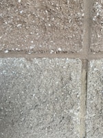 Close-up of a freshly molded concrete block showing texture and sharp edges.