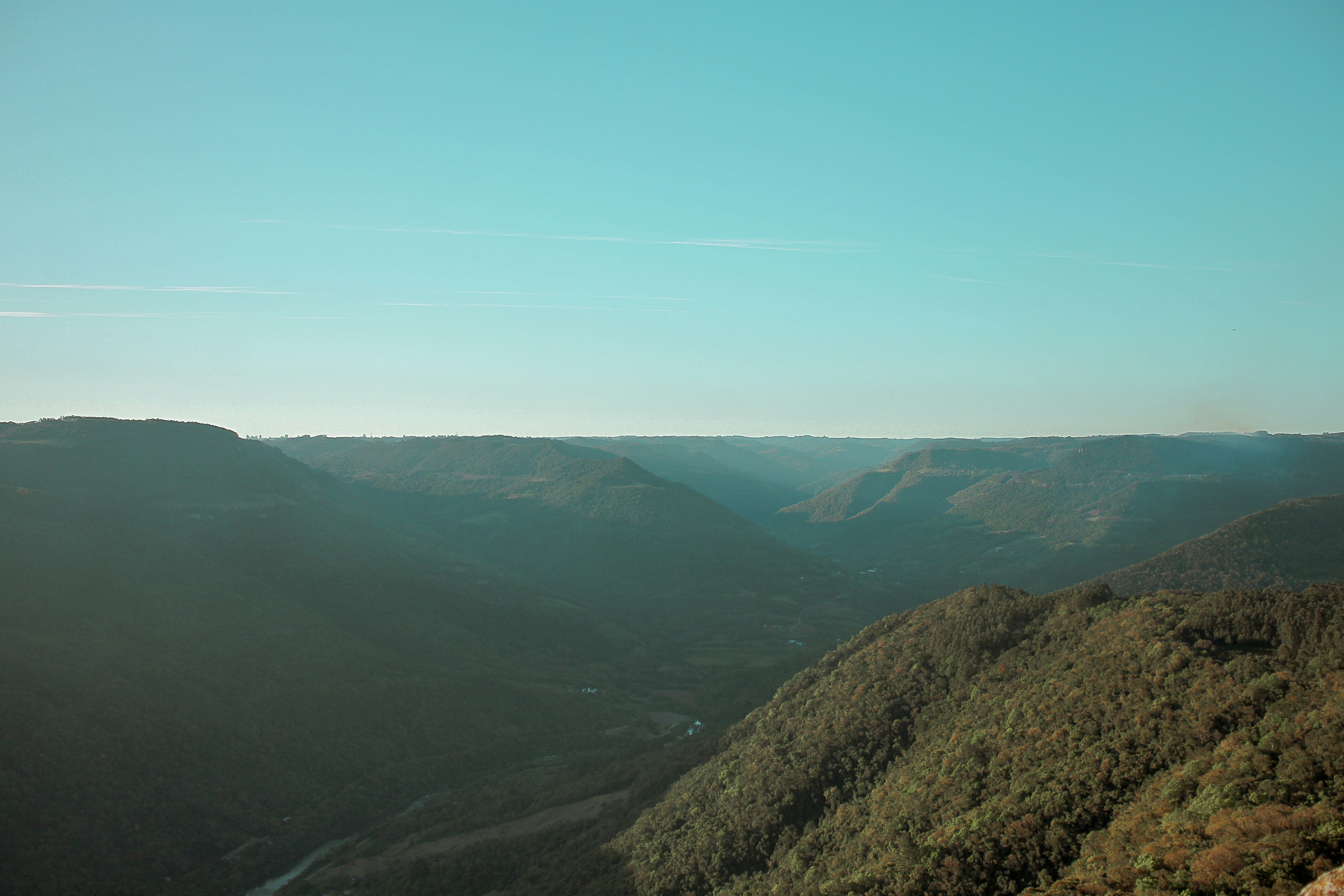 a landscape with hills and a road