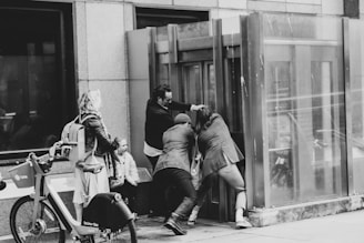 S2S team member carefully opening a jammed door with professional tools.