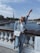 A happy traveler enjoying a guided tour in France.
