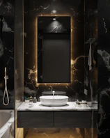 Custom vanity with dark wood finish, backlit mirror, and elegant gold hardware in a spacious bathroom.