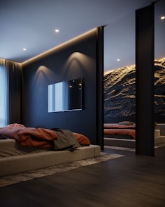 a room with a bed and a tv on the wall