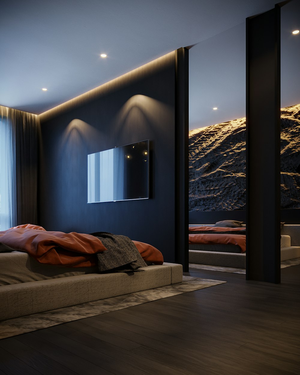 une chambre avec un lit et une télévision au mur
