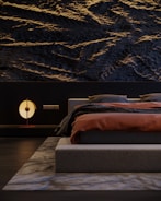 Contemporary bedroom with soft textures and muted color palette.