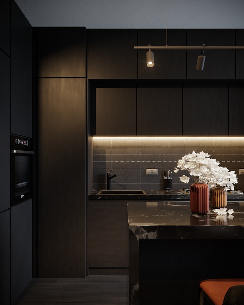 Kitchen with layered lighting including pendant lights, under-cabinet lighting, and recessed ceiling lights