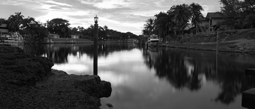 a body of water with a dock and trees around it