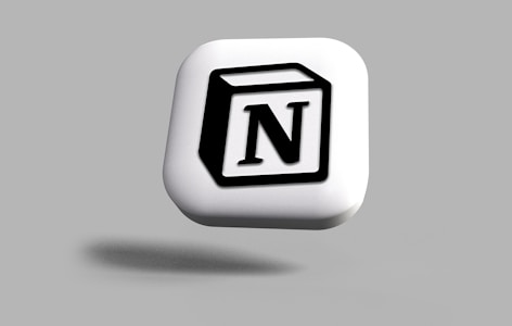 A three-dimensional icon resembling a white cube with a black letter 'N' on one side. The design is simple and modern, with the cube appearing to be floating against a gray background.