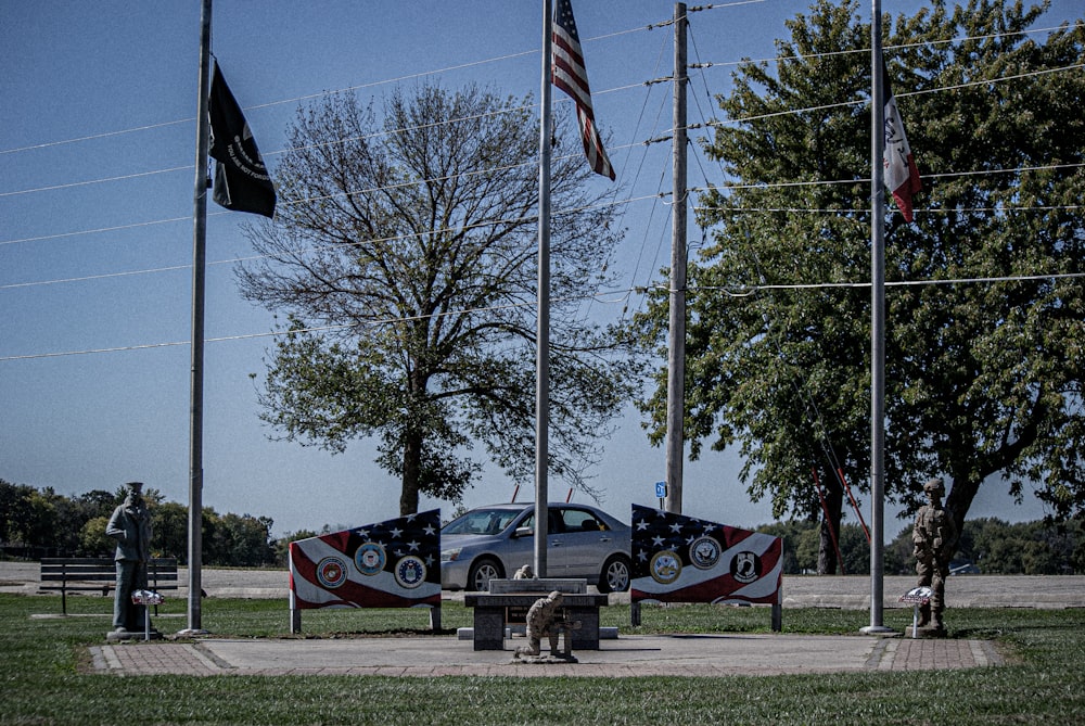 a group of flags on poles