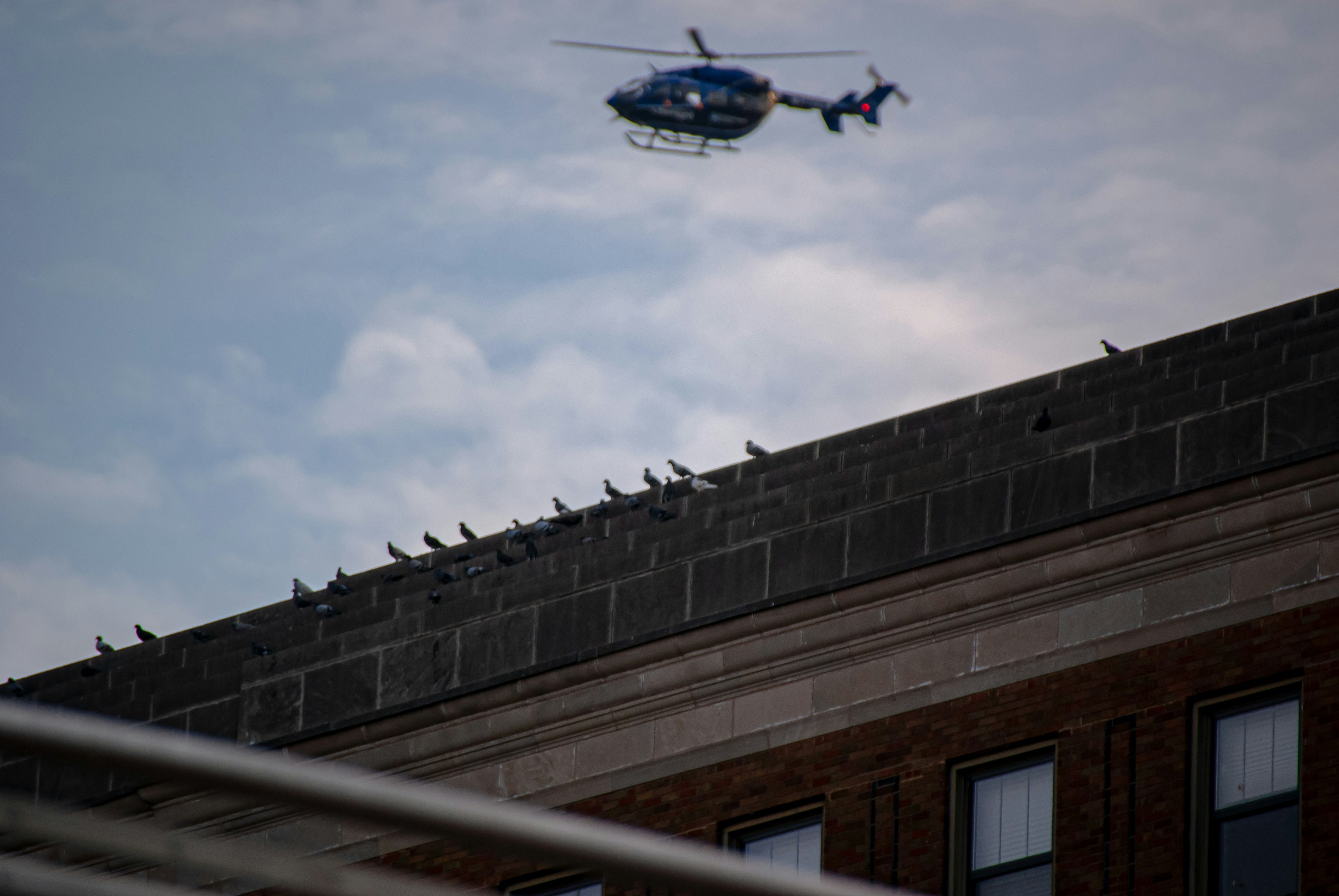 a helicopter flying over a building