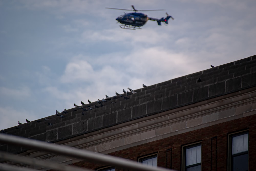 a helicopter flying over a building