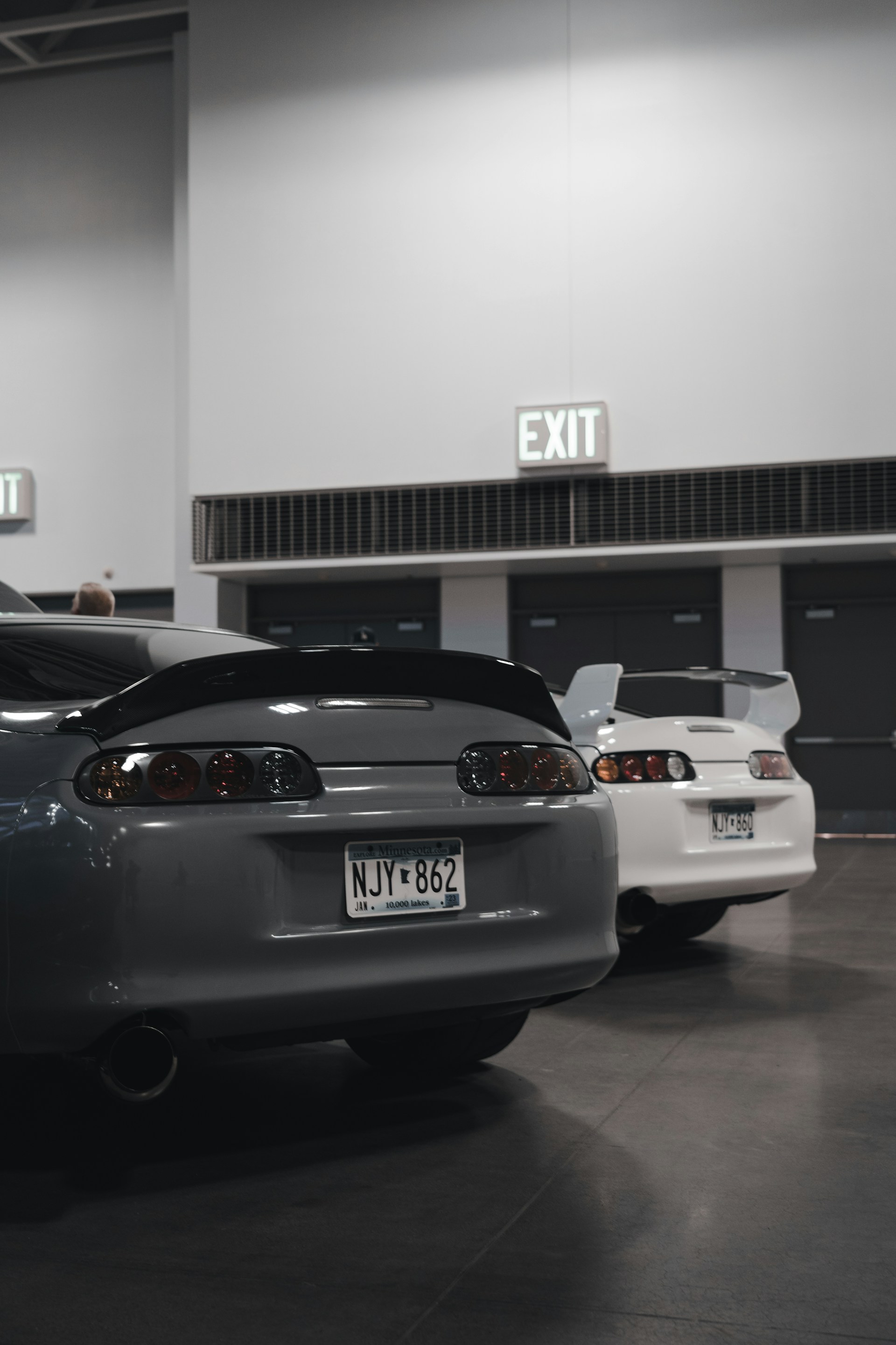 a group of cars parked in a garage