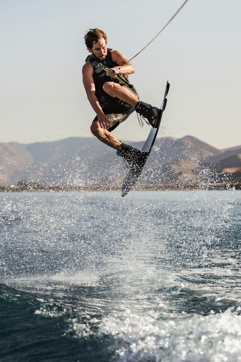 a man kite surfing on the sea