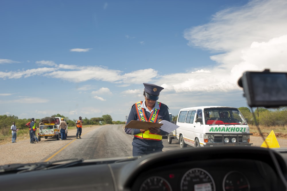 a police officer standing in the middle of the road