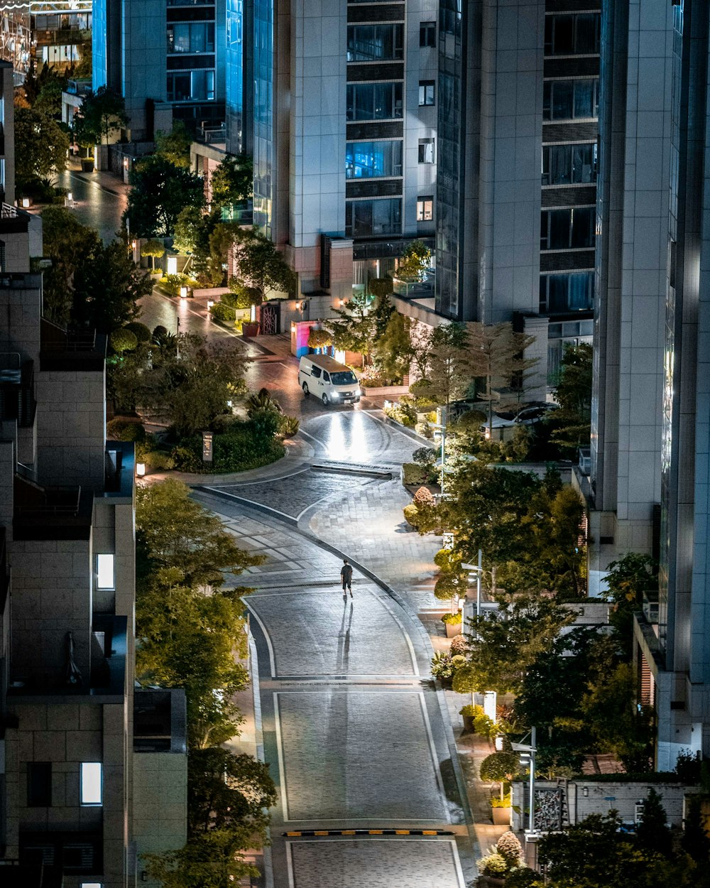 a street with cars and trees