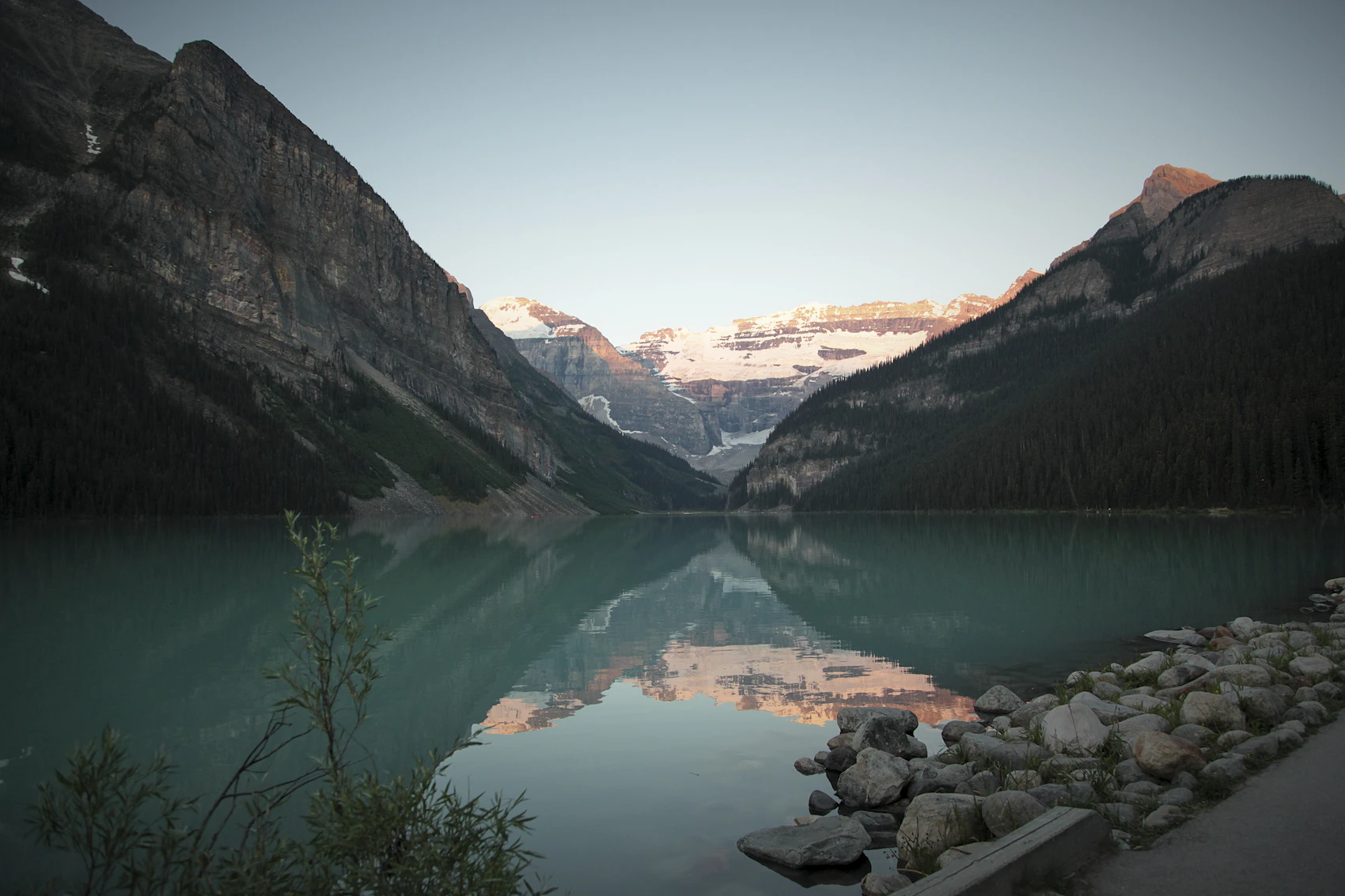 Lake Louise resting beneath the Canadian Rockies in early morning light