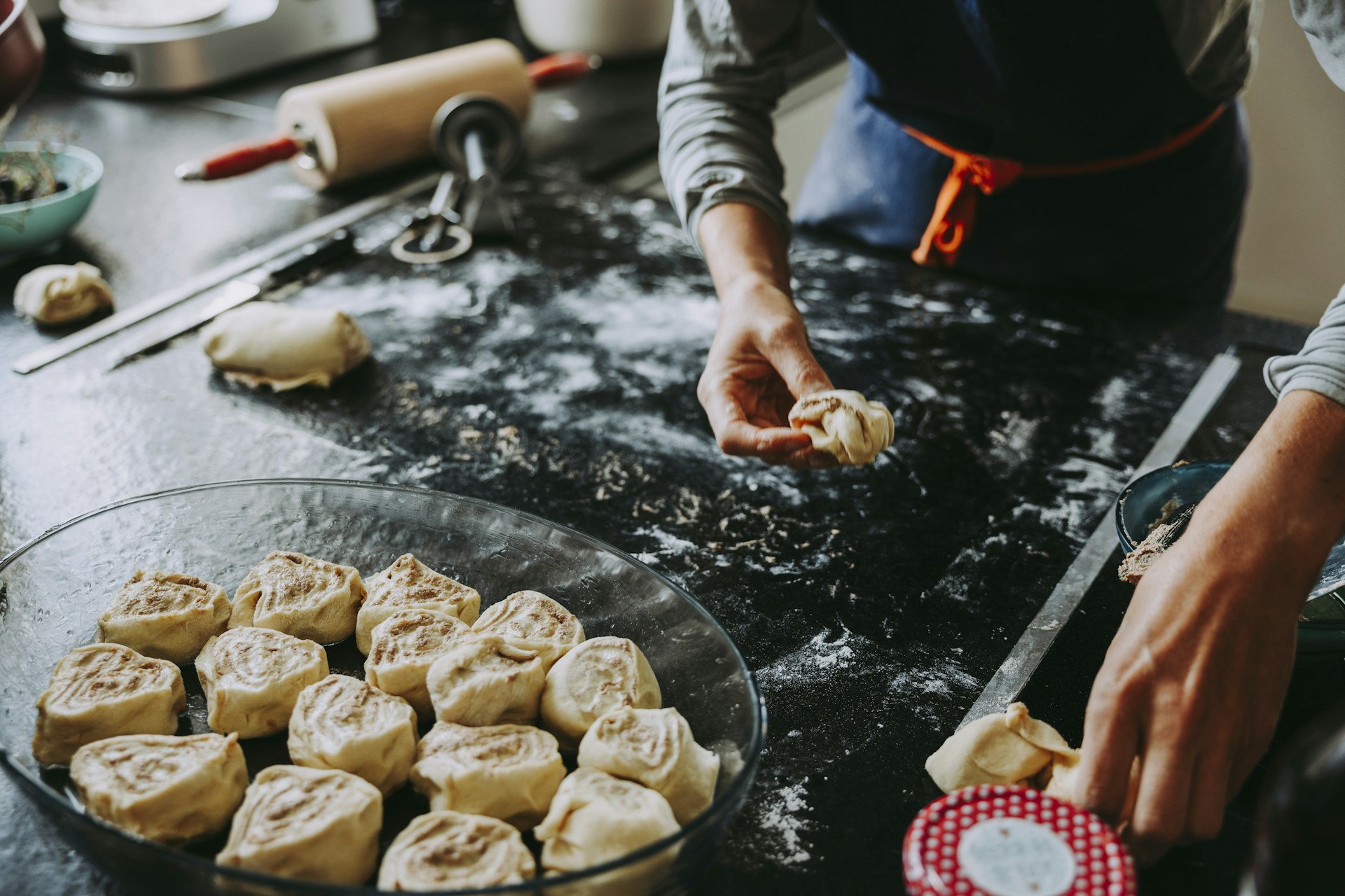 a person cooking cookies on a stove