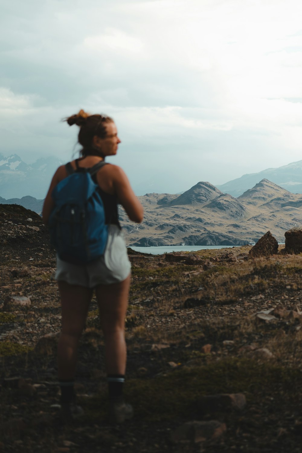 a man with a backpack on a rocky mountain