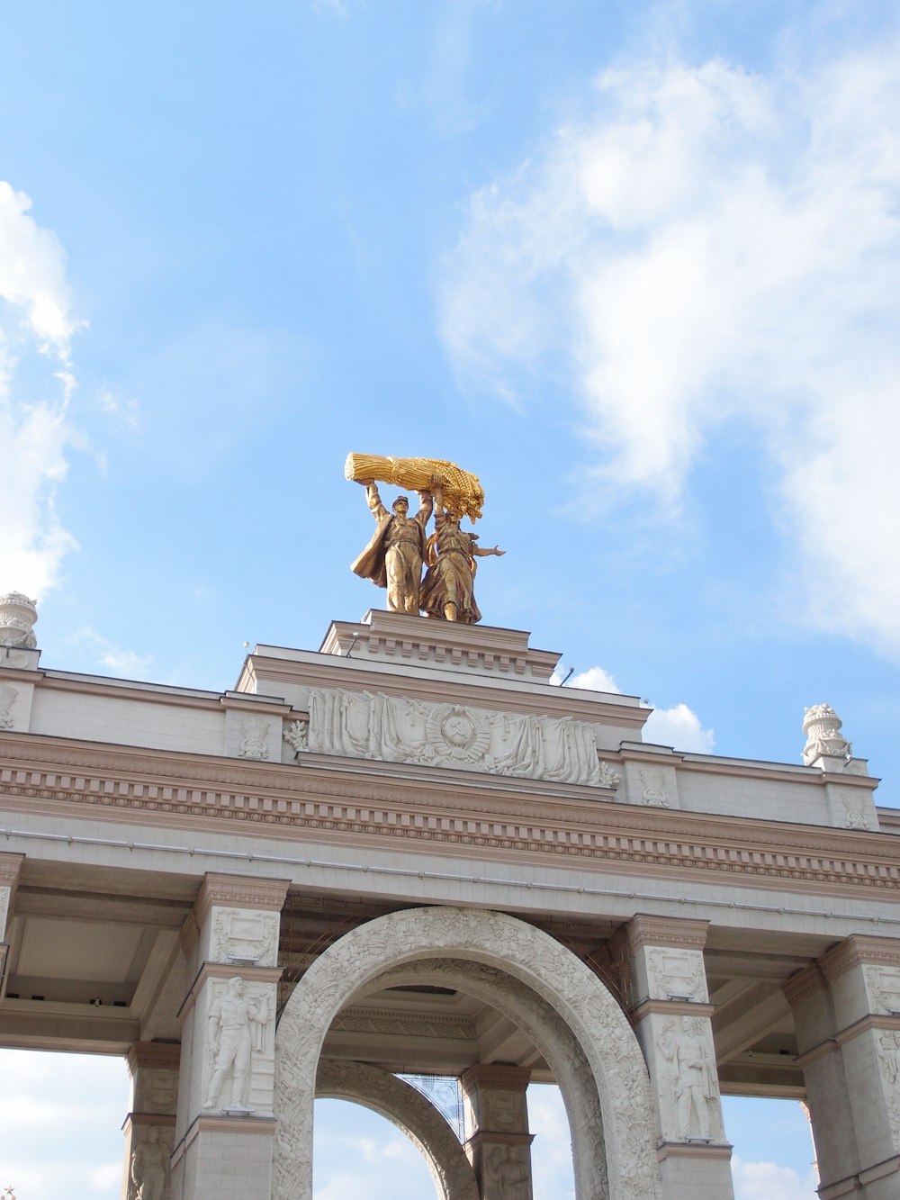 a building with statues on top