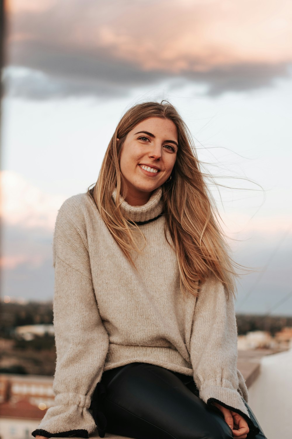 a person sitting on a ledge