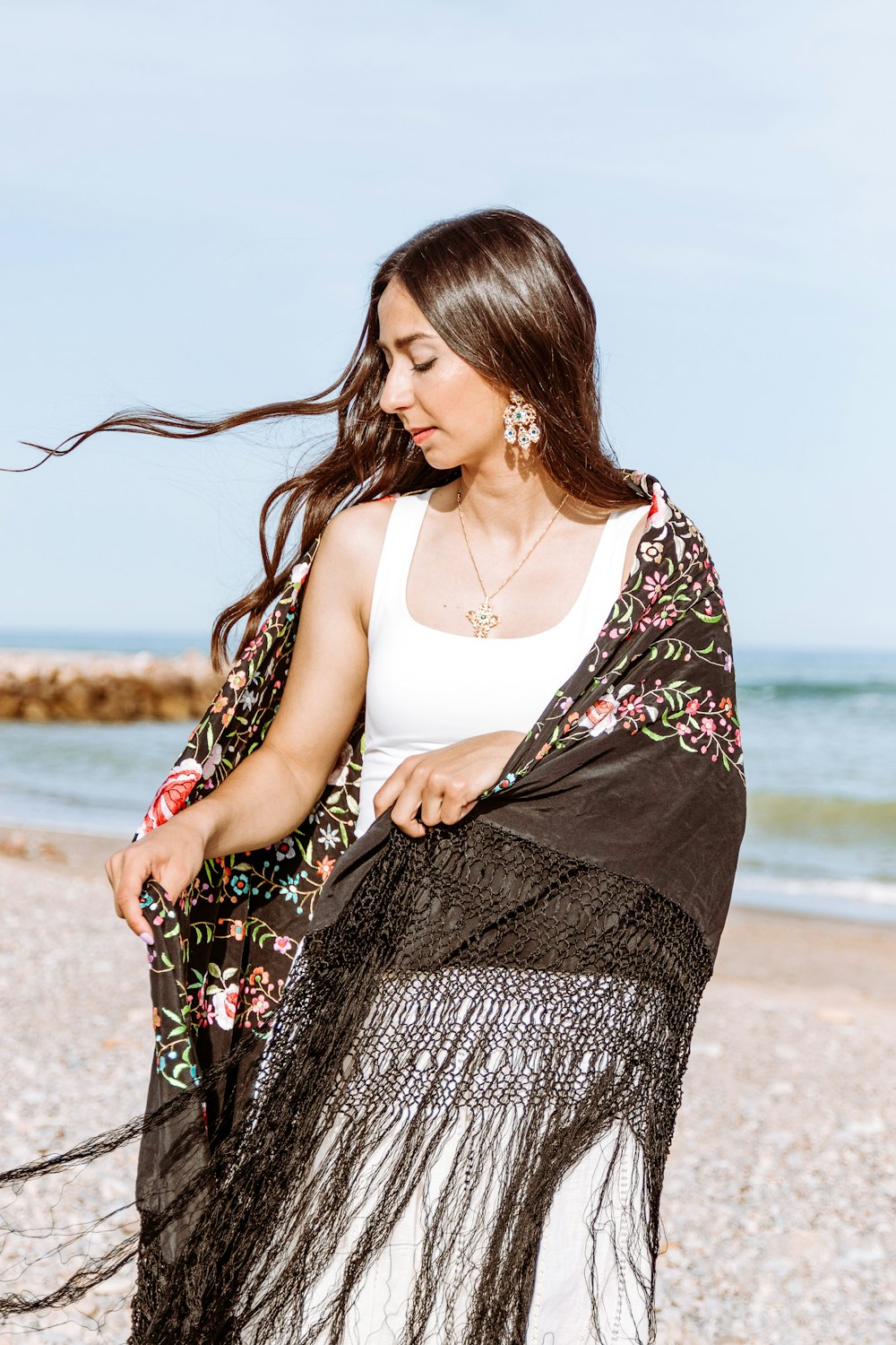 a woman in a dress on a beach