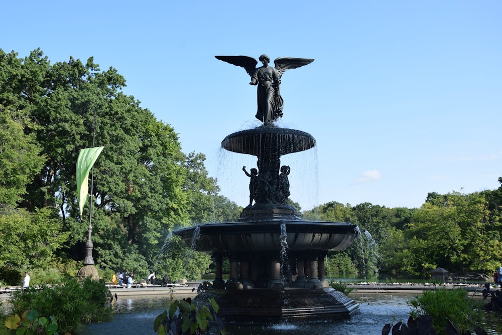 a statue of a person on a horse on a fountain