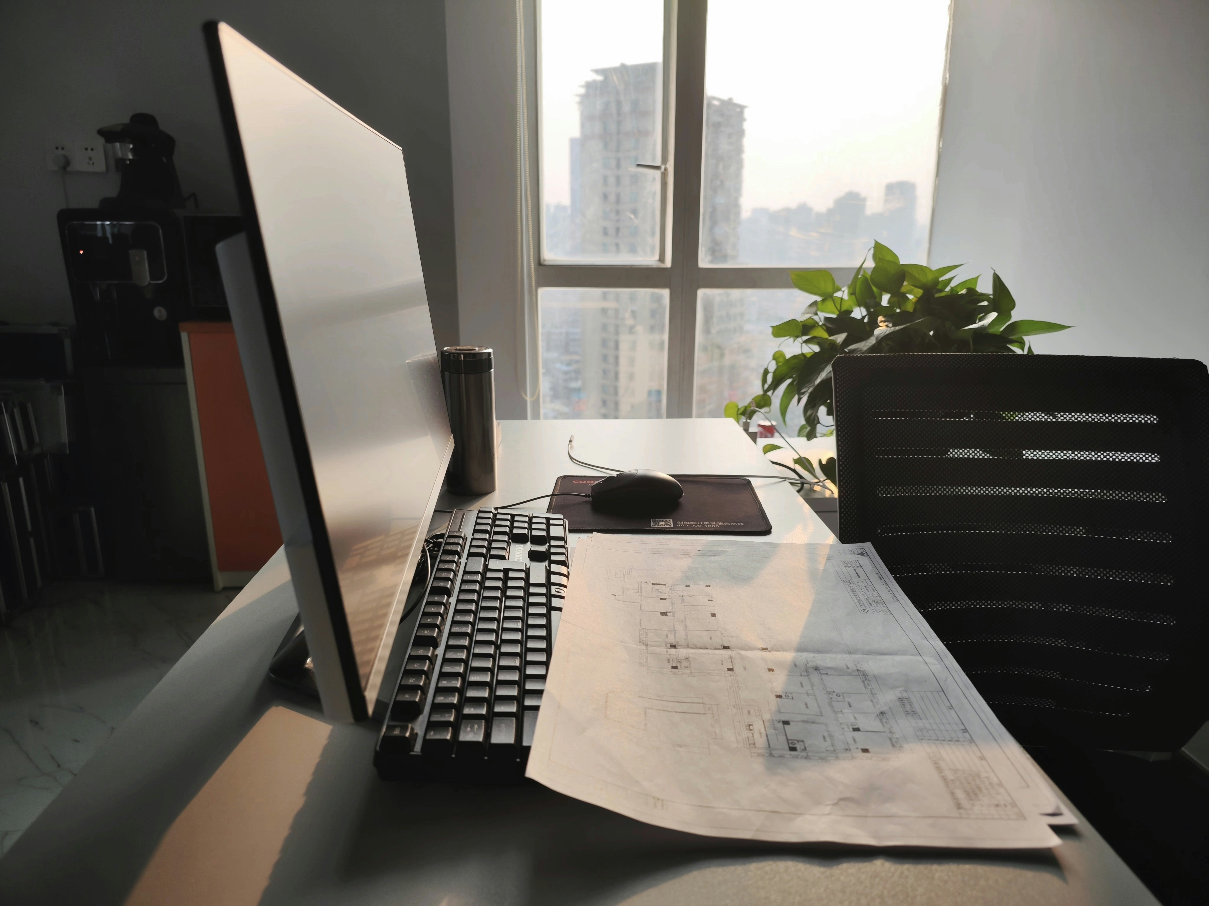 A clean, modern desk with architectural blueprints laid out, symbolizing clear structure and planning for content.