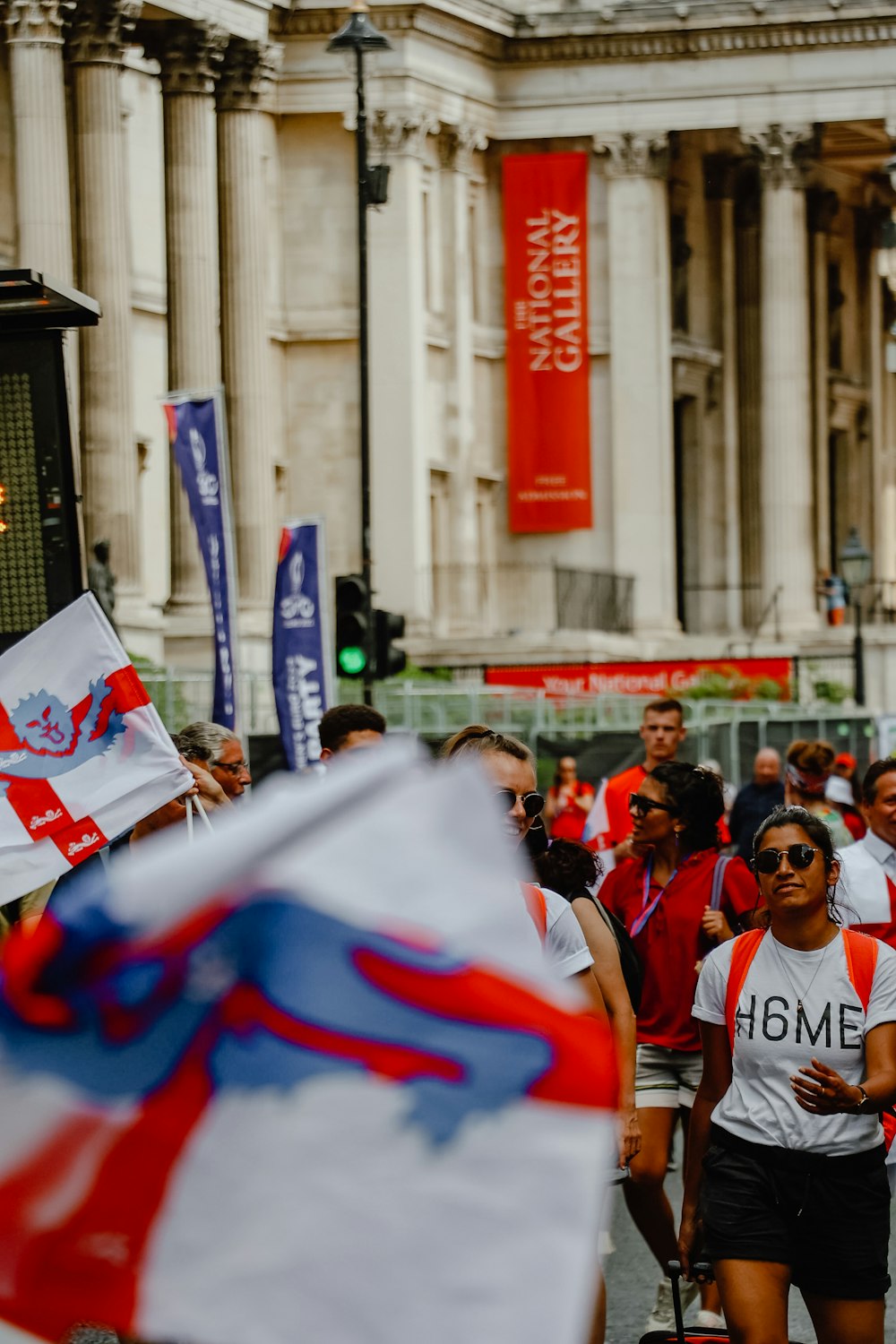 a group of people marching with flags