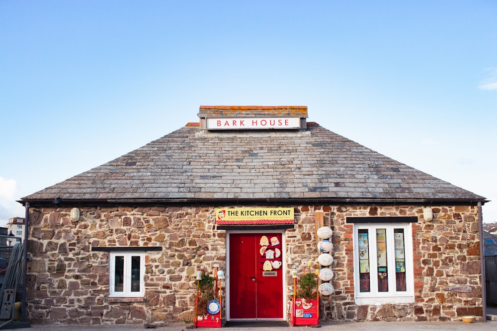 a brick building with a sign on it