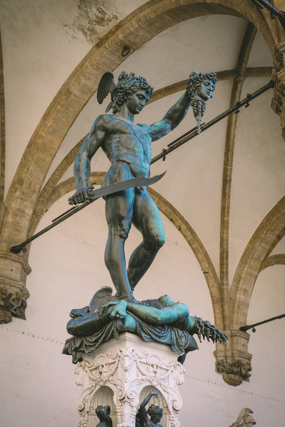 a statue of a person holding a sword
